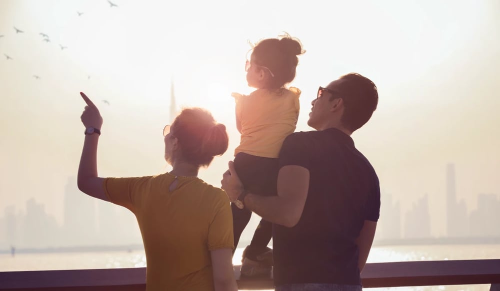 Young expat family watching Dubai sunset